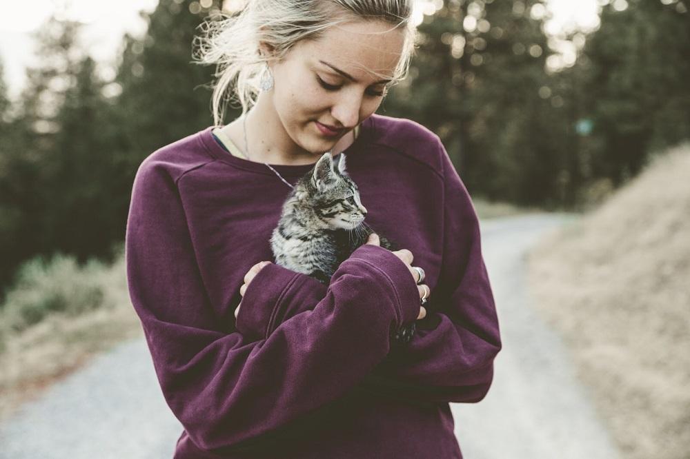 woman holding cat